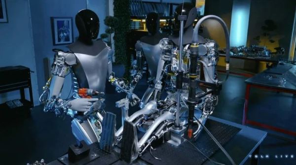 Tesla показала, как размножаются человекоподобные роботы Optimus: двое делают третьего 